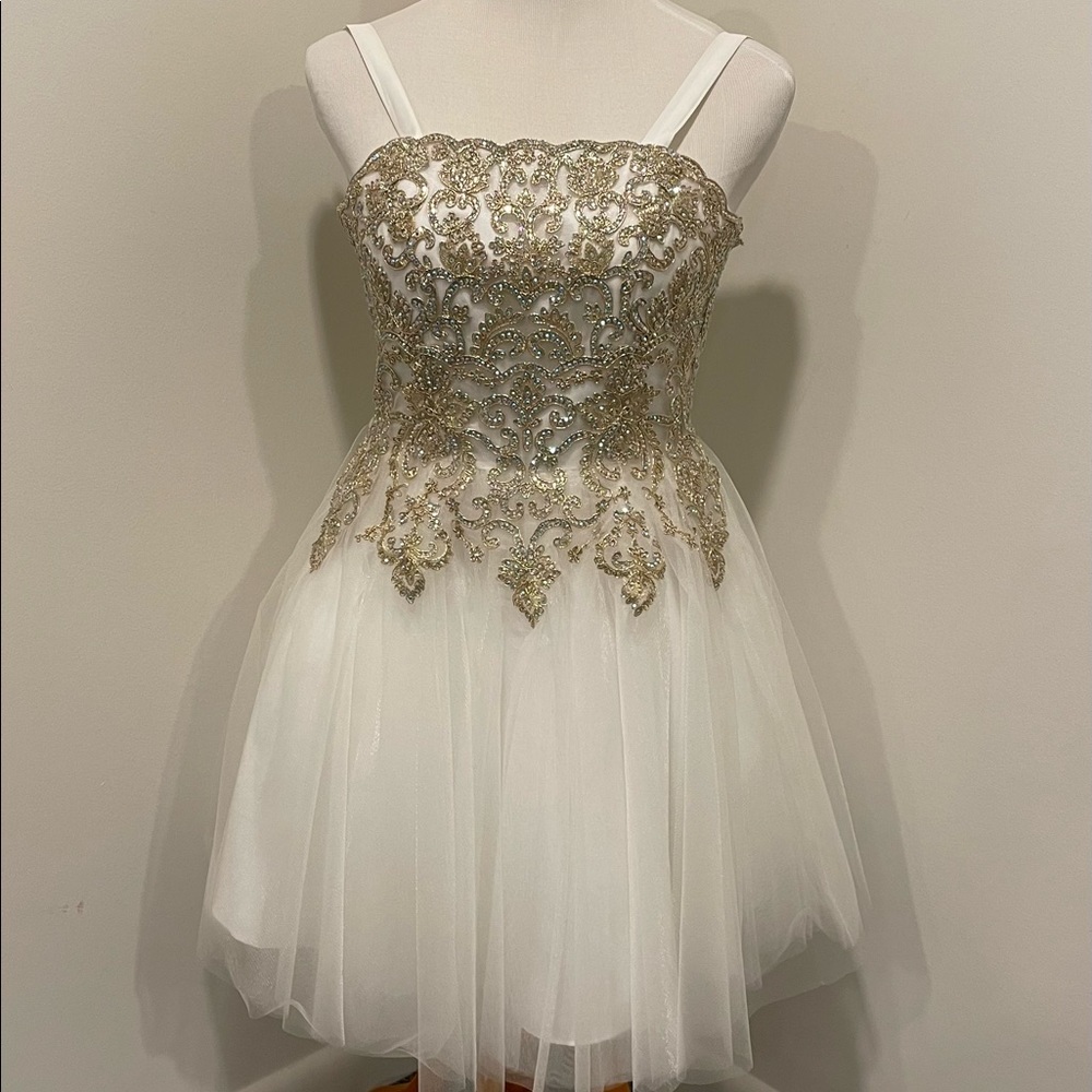 White Jovani organza dress. Exquisite gold detailing.